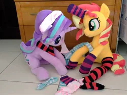 Size: 1024x768 | Tagged: safe, artist:nekokevin, derpibooru import, starlight glimmer, sunset shimmer, pony, unicorn, series:nekokevin's glimmy, clothes, cute, duo, female, glimmerbetes, horn sock, irl, looking down, mare, photo, plushie, shimmerbetes, sitting, smiling, socks, striped socks