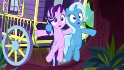 Size: 1280x720 | Tagged: safe, derpibooru import, screencap, starlight glimmer, trixie, pony, unicorn, road to friendship, duo, female, mare, swamp, tree, trixie's wagon