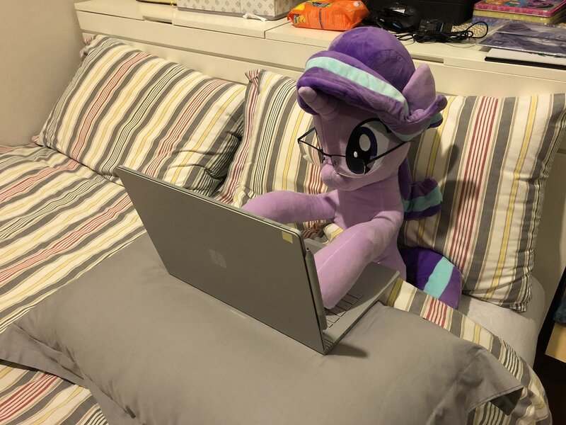 Size: 1200x900 | Tagged: safe, artist:nekokevin, derpibooru import, starlight glimmer, pony, unicorn, series:nekokevin's glimmy, adorkable, bed, bedsheets, computer, cute, dork, female, glasses, irl, laptop computer, mare, photo, pillow, plushie, raised hoof, solo