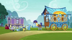 Size: 1280x720 | Tagged: safe, derpibooru import, screencap, hoo'far, trixie, pony, saddle arabian, unicorn, road to friendship, clothes, duo, female, goggles, hoo'far's wagon, male, mare, ms. powerful, stallion, trixie's wagon, wagon