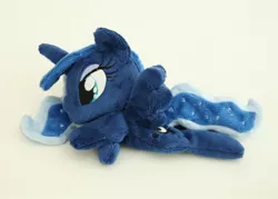 Size: 1000x716 | Tagged: safe, artist:yukamina-plushies, derpibooru import, princess luna, alicorn, pony, beanie (plushie), female, horn, irl, mare, missing accessory, photo, plushie, prone, solo, spread wings, wings