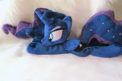 Size: 1024x683 | Tagged: safe, artist:kazzysart, derpibooru import, princess luna, alicorn, pony, beanie (plushie), female, folded wings, horn, irl, mare, missing accessory, photo, plushie, prone, solo, wings