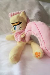 Size: 3648x5472 | Tagged: safe, artist:kazzysart, derpibooru import, fluttershy, pegasus, pony, beanie (plushie), female, folded wings, irl, lidded eyes, mare, photo, plushie, prone, solo, underhoof, wings