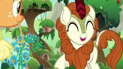 Size: 1280x720 | Tagged: safe, derpibooru import, screencap, applejack, autumn blaze, earth pony, kirin, pony, sounds of silence, spoiler:s08, cute, duo, eyes closed, female, flower, foal's breath, mare, mouth hold