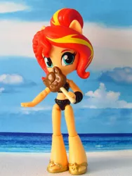 Size: 1530x2040 | Tagged: safe, artist:whatthehell!?, derpibooru import, sunset shimmer, equestria girls, beach, candy, clothes, doll, equestria girls minis, food, irl, lollipop, merchandise, photo, ponied up, sandals, swimsuit, toy