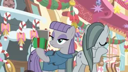 Size: 1920x1080 | Tagged: safe, derpibooru import, screencap, marble pie, maud pie, earth pony, pony, best gift ever, bell, bow, box, candy, candy cane, decoration, duo, female, fireplace, food, hearth's warming, hearth's warming ornament, hoof over mouth, laughing, mare, maud being maud, pinkie pie's room, present, rock-in-the-box, siblings, sisters, sugarcube corner