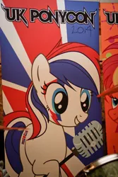 Size: 640x960 | Tagged: safe, derpibooru import, oc, oc:britannia (uk ponycon), unofficial characters only, earth pony, pony, 2014, aladdin sane, convention, david bowie, female, irl, mare, mascot, microphone, photo, uk ponycon, united kingdom