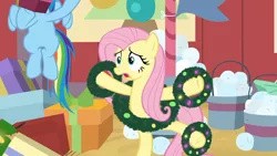 Size: 1920x1080 | Tagged: safe, derpibooru import, screencap, fluttershy, rainbow dash, pegasus, pony, hearth's warming shorts, the great escape room, bucket, solo focus, standing, standing on one leg, wreath