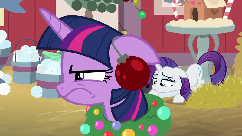 Size: 1280x720 | Tagged: safe, derpibooru import, screencap, rarity, twilight sparkle, twilight sparkle (alicorn), alicorn, pony, hearth's warming shorts, the great escape room, christmas wreath, female, floppy ears, glare, hay, ornament, twilight is not amused, unamused, wavy mouth, wreath