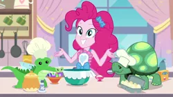 Size: 1280x720 | Tagged: safe, derpibooru import, screencap, gummy, pinkie pie, tank, equestria girls, equestria girls series, the craft of cookies, spoiler:eqg series (season 2), apron, clothes, cute, diapinkes, egg (food), food, gemstones, kitchen, looking at you, vanilla extract