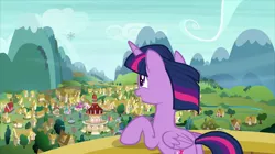 Size: 2880x1618 | Tagged: safe, derpibooru import, screencap, twilight sparkle, twilight sparkle (alicorn), alicorn, pony, the crystalling, butt, female, fluttershy's cottage, mare, mountain, plot, ponyville, ponyville schoolhouse, ponyville town hall, scenery, smiling, snowflake envelope, solo, town hall