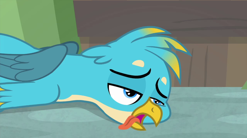 Size: 1280x720 | Tagged: safe, derpibooru import, screencap, gallus, gryphon, teacher of the month (episode), spoiler:interseason shorts, birb, bored, cheek squish, cute, floor, frown, gallabetes, lidded eyes, male, open mouth, prone, sad, solo, squishy cheeks, tongue out