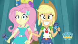 Size: 1920x1080 | Tagged: safe, derpibooru import, screencap, applejack, fluttershy, best in show: the pre-show, equestria girls, equestria girls series, spoiler:eqg series (season 2), geode of fauna, geode of super strength, grin, magical geodes, microphone, smiling