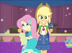 Size: 1464x1077 | Tagged: safe, derpibooru import, screencap, applejack, fluttershy, best in show: the pre-show, equestria girls, equestria girls series, spoiler:eqg series (season 2), cropped, geode of fauna, geode of super strength, magical geodes, microphone