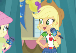 Size: 800x567 | Tagged: safe, derpibooru import, screencap, applejack, fluttershy, best in show: the pre-show, equestria girls, equestria girls series, spoiler:eqg series (season 2), animated, cropped, geode of fauna, geode of super strength, grin, magical geodes, microphone, smiling