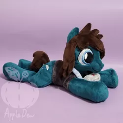 Size: 1248x1248 | Tagged: safe, artist:appledew, derpibooru import, ponified, earth pony, pony, beanie (plushie), camera, clothes, commission, irl, male, photo, plushie, prone, shirt, smiling, solo, stallion, t-shirt, tom sykes, watermark