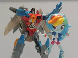 Size: 1024x768 | Tagged: safe, artist:lonetrekker, derpibooru import, rainbow dash, equestria girls, action figure, clash of hasbro's titans, crossover, doll, equestria girls minis, eqventures of the minis, starscream, starscream vs rainbow dash, toy, transformers, transformers robots in disguise (2015)