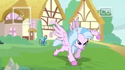 Size: 1920x1080 | Tagged: safe, derpibooru import, screencap, rainbow dash, silverstream, classical hippogriff, hippogriff, pegasus, pony, uprooted, >:), clothes, discovery family logo, dream, duo, female, fist, goggles, mare, smiling, smirk, superhero landing, tv rating, tv-y, uniform, wonderbolts uniform