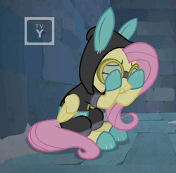 Size: 473x464 | Tagged: safe, derpibooru import, screencap, fluttershy, pony, sparkle's seven, animated, bunny ears, claustrophobia, clothes, costume, dangerous mission outfit, gif, goggles, hoodie, scared, solo, tv rating, tv-y