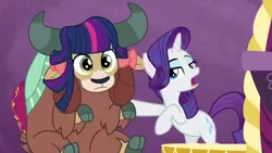 Size: 640x360 | Tagged: safe, derpibooru import, screencap, rarity, yona, pony, unicorn, yak, she's all yak, bow, cloven hooves, duo, female, fit right in, hair bow, implied twilight sparkle, mare, purple background, simple background, twilight wig, wig