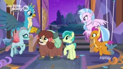 Size: 1280x720 | Tagged: safe, derpibooru import, screencap, gallus, ocellus, sandbar, silverstream, smolder, yona, changedling, changeling, classical hippogriff, dragon, earth pony, gryphon, hippogriff, pony, yak, she's all yak, bow, bowtie, cloven hooves, colored hooves, discovery family logo, dragoness, female, flying, hair bow, jewelry, male, monkey swings, necklace, student six, teenager