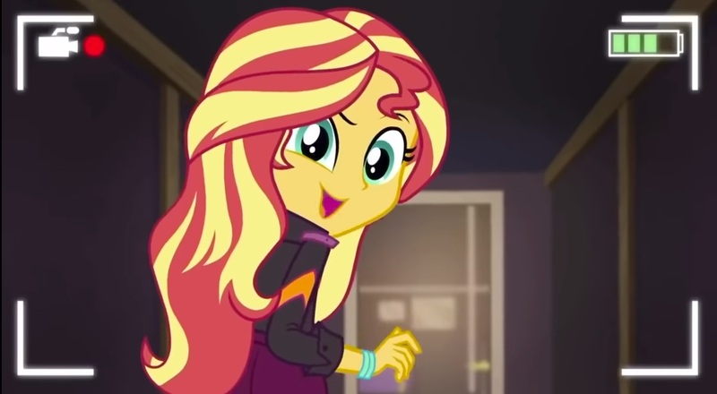 Size: 1281x705 | Tagged: safe, derpibooru import, screencap, sunset shimmer, equestria girls, equestria girls series, how to backstage, spoiler:eqg series (season 2), cute, looking at you, looking back, looking back at you, open mouth, raised eyebrow, recording, selfie drone, shimmerbetes, smiling, solo
