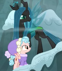 Size: 507x583 | Tagged: safe, derpibooru import, screencap, cozy glow, queen chrysalis, changeling, changeling queen, pegasus, pony, frenemies (episode), clothes, cropped, duo, female, filly, foal, hat, wind, winter outfit