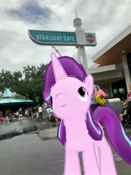 Size: 3024x4032 | Tagged: safe, derpibooru import, photographer:undeadponysoldier, starlight glimmer, human, pony, unicorn, augmented reality, building, carousel, cosmic ray's starlight cafe, disney world, female, i see what you did there, irl, irl human, looking up, magic kingdom, mare, namesake, not photoshoped, photo, ponies in real life, puddle, pun, restaurant, sign, vacation
