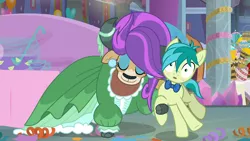 Size: 2560x1440 | Tagged: safe, derpibooru import, screencap, sandbar, yona, earth pony, pony, yak, she's all yak, alternate hairstyle, blushing, bowtie, clothes, cloven hooves, dancing, dress, duo, ear piercing, earring, female, jewelry, makeup, male, piercing, punch (drink), punch bowl, shipping, straight, teenager, yonabar