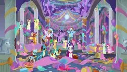 Size: 1280x720 | Tagged: safe, derpibooru import, screencap, applejack, fluttershy, gallus, ocellus, pinkie pie, rainbow dash, rarity, sandbar, silverstream, smolder, spike, twilight sparkle, twilight sparkle (alicorn), alicorn, changedling, changeling, classical hippogriff, dragon, earth pony, gryphon, hippogriff, pegasus, pony, unicorn, she's all yak, background pony, banner, bucket, colored hooves, cowboy hat, dj scales and tail, dragoness, female, flying, food, hat, jewelry, male, mane seven, mane six, mare, necklace, school of friendship, stallion, statue, teenager