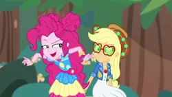 Size: 1280x720 | Tagged: safe, derpibooru import, screencap, applejack, pinkie pie, accountibilibuddies, equestria girls, equestria girls series, spoiler:choose your own ending (season 2), spoiler:eqg series (season 2), accountibilibuddies: pinkie pie, applejack's sunglasses, bush, clothes, confused, cute, diapinkes, evil grin, geode of sugar bombs, grin, hair bun, hat, jacket, looking at someone, magical geodes, outdoors, raised eyebrow, sitting, smiling, standing, sunglasses, tree