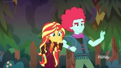 Size: 1280x720 | Tagged: safe, derpibooru import, screencap, oxford brush, sunset shimmer, equestria girls, equestria girls series, sunset's backstage pass!, spoiler:eqg series (season 2), background human, clothes, discovery family logo, ear plugs, female, geode of empathy, jacket, magical geodes, male