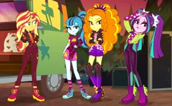 Size: 1418x880 | Tagged: safe, derpibooru import, screencap, adagio dazzle, aria blaze, sonata dusk, sunset shimmer, equestria girls, equestria girls series, sunset's backstage pass!, spoiler:eqg series (season 2), boots, bracelet, clothes, converse, cropped, crossed arms, dress, female, hand on hip, high heel boots, jacket, legs, outdoors, pigtails, ponytail, quartet, shoes, shorts, smiling, smirk, sneakers, socks, spiked wristband, striped socks, sunset shimmer is not amused, taco dress, the dazzlings, tour bus, twintails, unamused, wristband