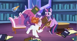 Size: 935x506 | Tagged: safe, derpibooru import, screencap, rarity, twilight sparkle, twilight sparkle (alicorn), alicorn, pony, unicorn, dragon dropped, book, couch, library, twilight's castle, twilight's castle library