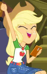 Size: 531x843 | Tagged: safe, derpibooru import, screencap, applejack, costume conundrum, equestria girls, equestria girls series, spoiler:eqg series (season 2), cropped, female, fist in the air, geode of super strength, iphone, magical geodes, mobile phone, phone, sitting, smartphone, smiling, solo, sunset's apartment