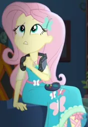 Size: 673x964 | Tagged: safe, derpibooru import, screencap, fluttershy, costume conundrum, equestria girls, equestria girls series, spoiler:choose your own ending (season 2), spoiler:eqg series (season 2), controller, couch, cropped, female, geode of fauna, headset, headset mic, magical geodes, sitting, solo, sunset's apartment, thinking