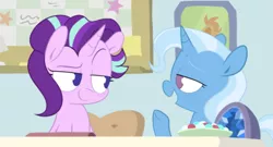 Size: 500x270 | Tagged: safe, artist:pinkiespresent, derpibooru import, starlight glimmer, trixie, pony, unicorn, desk, looking at each other, smiling, smirk, starlight's office