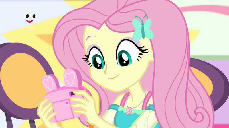 Size: 1280x720 | Tagged: safe, derpibooru import, screencap, fluttershy, equestria girls, equestria girls series, holidays unwrapped, spoiler:eqg series (season 2), camera, clothes, geode of fauna, magical geodes, pink camera, plusplus, smiling