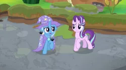 Size: 1600x896 | Tagged: safe, derpibooru import, screencap, starlight glimmer, trixie, pony, a horse shoe-in, bog, burnt, cape, clothes, hat, singed, trixie's cape, trixie's hat