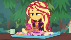 Size: 1280x720 | Tagged: safe, derpibooru import, screencap, sunset shimmer, equestria girls, equestria girls series, wake up!, spoiler:choose your own ending (season 2), spoiler:eqg series (season 2), candy, chocolate, donut, eating, food, hot chocolate, junk food, pastry, solo, sweets, this will end in diabetes, wake up!: pinkie pie