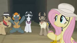Size: 1600x898 | Tagged: safe, derpibooru import, screencap, biff, doctor caballeron, fluttershy, rogue (character), withers, pony, daring doubt, cheering, fedora, happy, hat, henchmen, smiling, sunglasses, sunhat, truth talisman