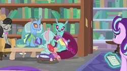 Size: 2000x1121 | Tagged: safe, derpibooru import, screencap, carapace (character), ocellus, octavia melody, spiracle, starlight glimmer, changedling, changeling, earth pony, pony, a horse shoe-in, book, bookshelf, bowtie, eyes closed, female, library, magic, magic aura, mare, sitting, telekinesis