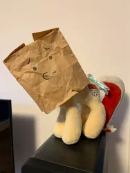 Size: 675x900 | Tagged: bow, derpibooru import, irl, i think that's not the paper bag pony, looking at you, oc, oc:colonia, oc:paper bag, paper bag, photo, plushie, safe, tail bow