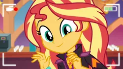 Size: 1920x1080 | Tagged: safe, derpibooru import, screencap, sunset shimmer, equestria girls, equestria girls series, how to backstage, spoiler:eqg series (season 2), camera shot, close-up, clothes, coffee machine, cute, female, jacket, looking at you, recording, selfie drone, shimmerbetes, smiling, solo