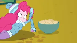 Size: 1600x900 | Tagged: safe, derpibooru import, screencap, pinkie pie, equestria girls, equestria girls series, holidays unwrapped, spoiler:eqg series (season 2), bowl, clothes, food, hat, jacket, lying down, mittens, potato, solo, sprinkles, toque, winter outfit