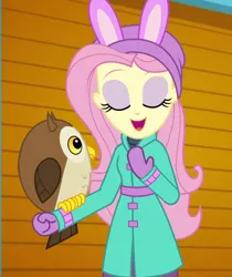 Size: 906x1080 | Tagged: safe, derpibooru import, screencap, chad (owl), fluttershy, bird, owl, equestria girls, equestria girls series, holidays unwrapped, spoiler:eqg series (season 2), clothes, coat, cropped, cute, eyes closed, female, fluttershy's winter hat, hat, mittens, open mouth, self-storage facility, shyabetes, winter coat, winter hat, winter outfit