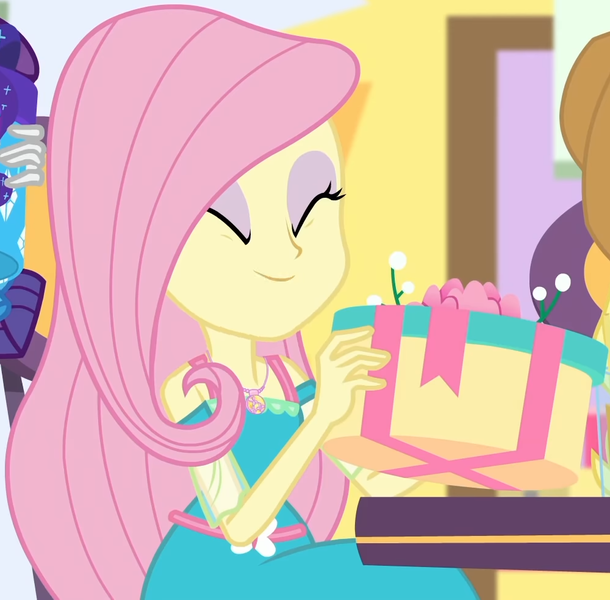 Size: 1000x983 | Tagged: safe, derpibooru import, screencap, fluttershy, rarity, equestria girls, equestria girls series, holidays unwrapped, spoiler:eqg series (season 2), applejack's hat, canterlot mall, chair, clothes, cowboy hat, cropped, cute, dashing through the mall, dress, eyes closed, female, flower, geode of fauna, gift giving, hat, jewelry, magical geodes, mall, necklace, present, shyabetes, sitting, smiling, table, waistband