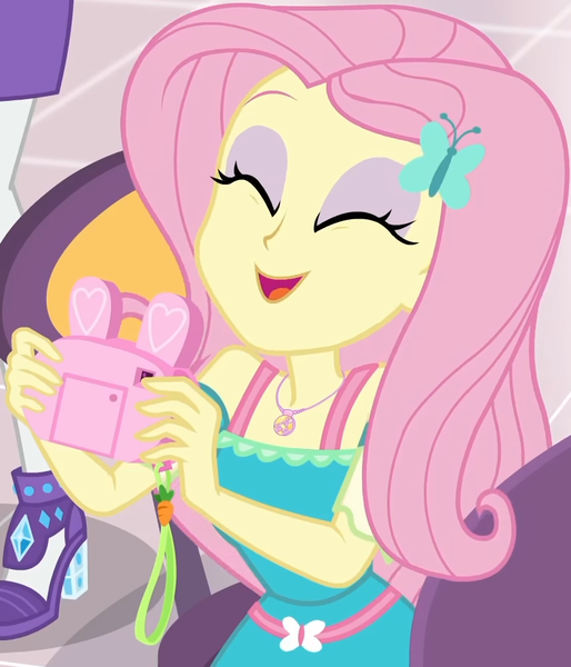 Size: 860x1004 | Tagged: safe, derpibooru import, screencap, fluttershy, rarity, equestria girls, equestria girls series, holidays unwrapped, spoiler:eqg series (season 2), bunny ears, camera, canterlot mall, chair, clothes, cropped, cute, dashing through the mall, dress, eyes closed, female, flower, geode of fauna, gift giving, hairclip, happy, jewelry, magical geodes, mall, necklace, present, shyabetes, sitting, smiling, table, waistband