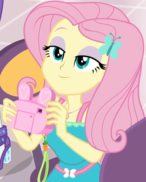 Size: 799x997 | Tagged: safe, derpibooru import, screencap, fluttershy, rarity, equestria girls, equestria girls series, holidays unwrapped, spoiler:eqg series (season 2), bunny ears, camera, canterlot mall, clothes, cropped, cute, dashing through the mall, dress, female, flower, geode of fauna, hairclip, happy, jewelry, lidded eyes, looking up, magical geodes, mall, necklace, present, shyabetes, smiling, waistband