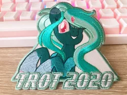 Size: 1277x957 | Tagged: safe, artist:pearlyiridescence, derpibooru import, oc, oc:proxy server, unofficial characters only, pony, convention, convention mascots, craft, cute, embroidery, female, keyboard, mascot, one eye closed, photo, smiling, solo, trotcon, wink, winking at you